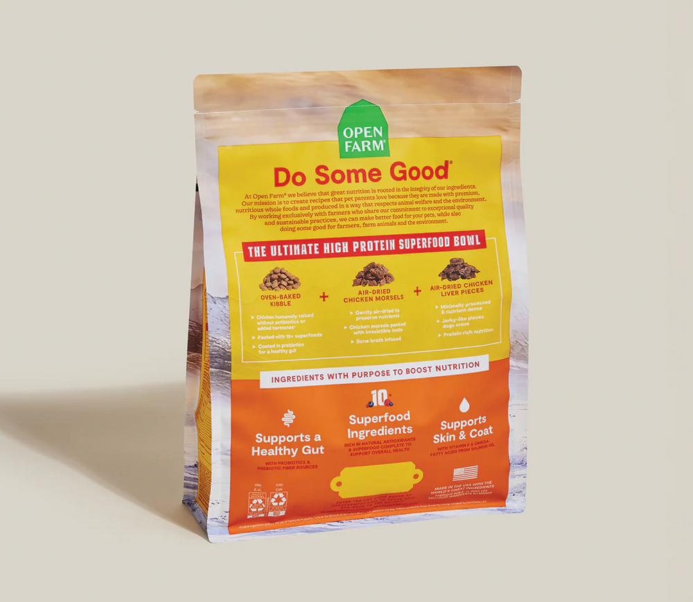 Open Farm pet food package with a yellow label on a beige background
