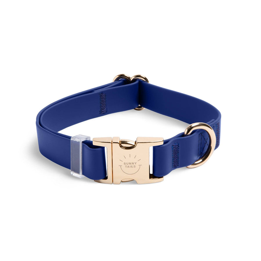 Navy Sunny Tails dog collar with gold buckle on a white background
